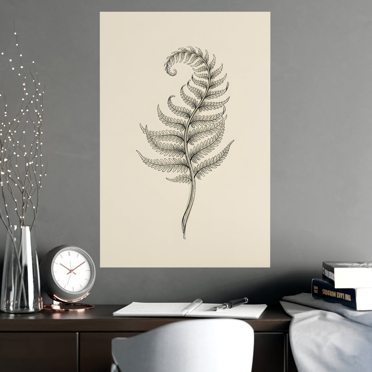 Fern Frond hung on a grey wall above a dark sofa, 20x30 in print
