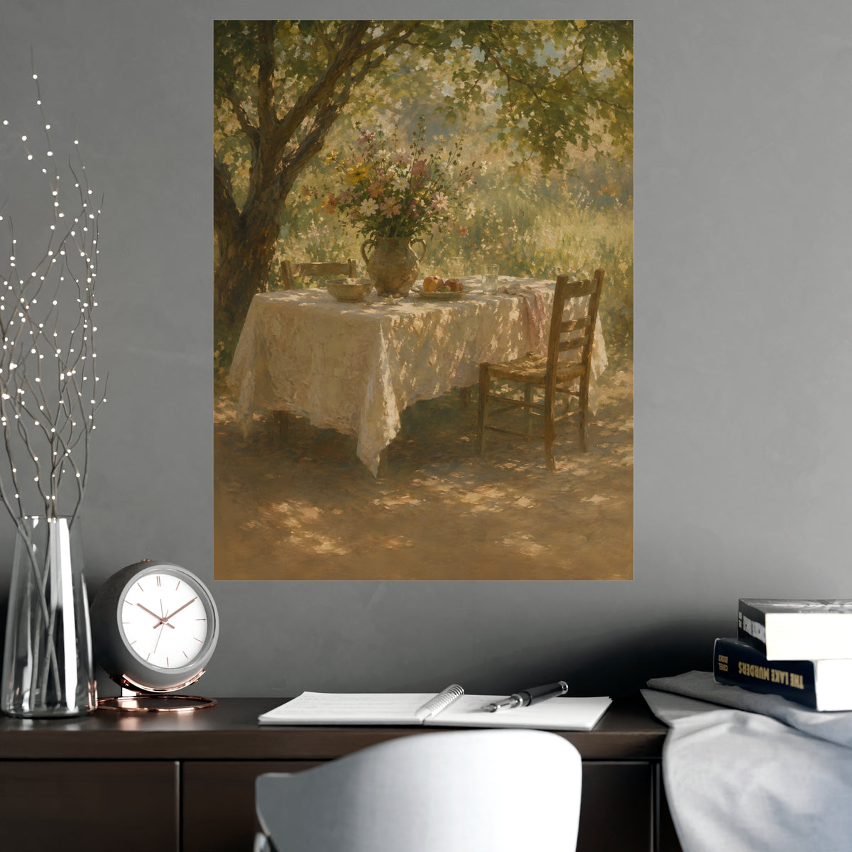 Table Under the Tree — a table under a tree with a linen cloth and a jug of wildflowers, shown framed on a wall