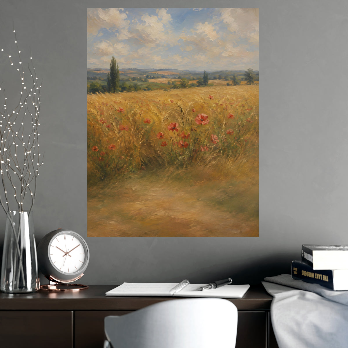 Poppies in the Wheat — wheat fields under a wide summer sky with poppies scattered through the gold, shown framed on a wall