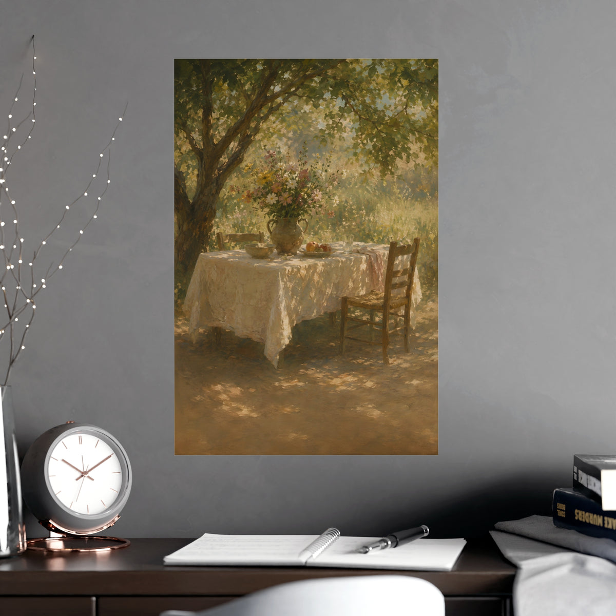 Table Under the Tree — a table under a tree with a linen cloth and a jug of wildflowers, shown framed on a wall