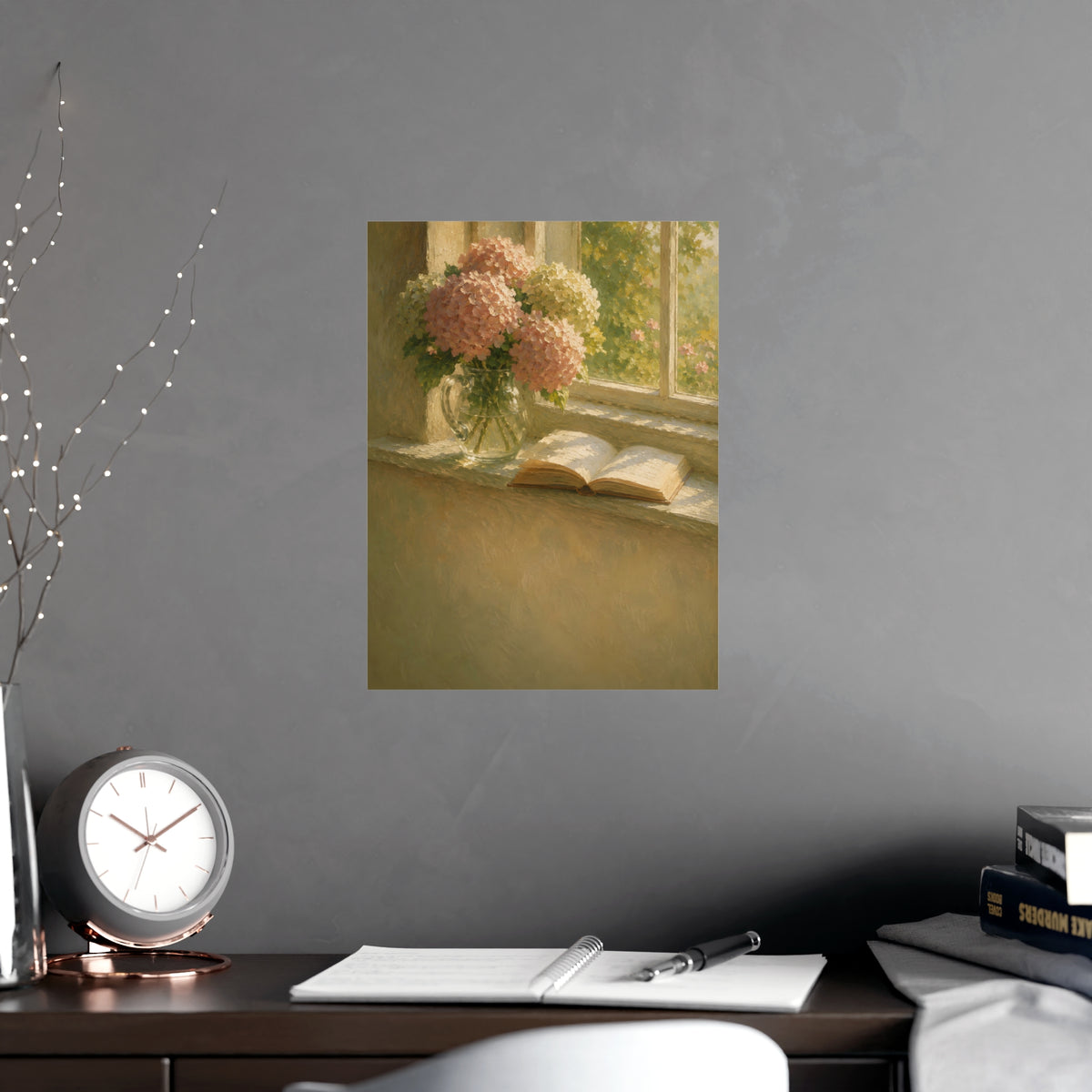 Hydrangeas and a Book — hydrangeas in a glass jug beside an open book on a sunlit windowsill, shown framed on a wall