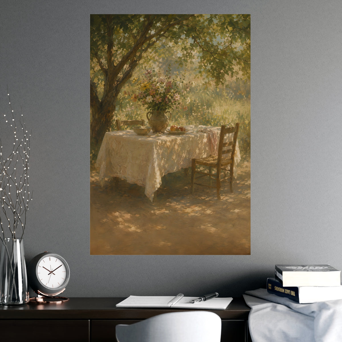 Table Under the Tree — a table under a tree with a linen cloth and a jug of wildflowers, shown framed on a wall