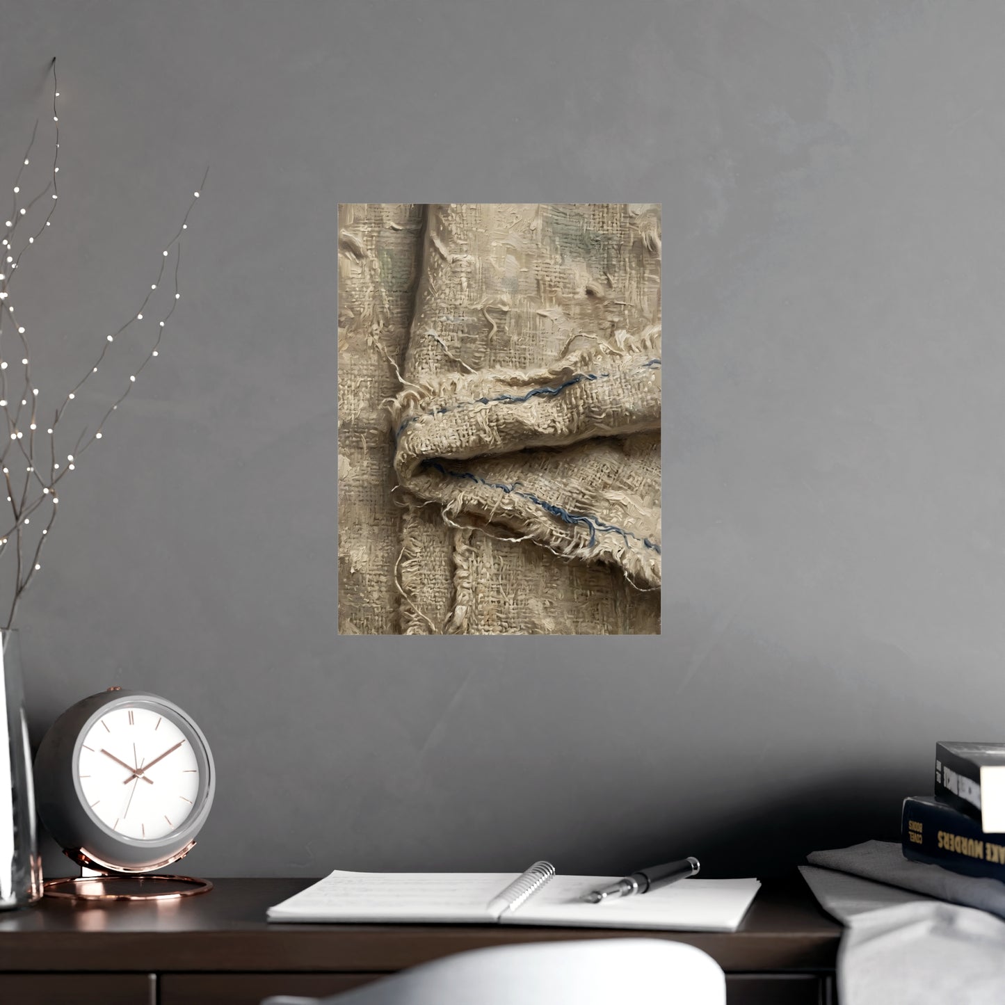 Folded Linen hung on a grey wall above a dark sofa, 12x18 in print