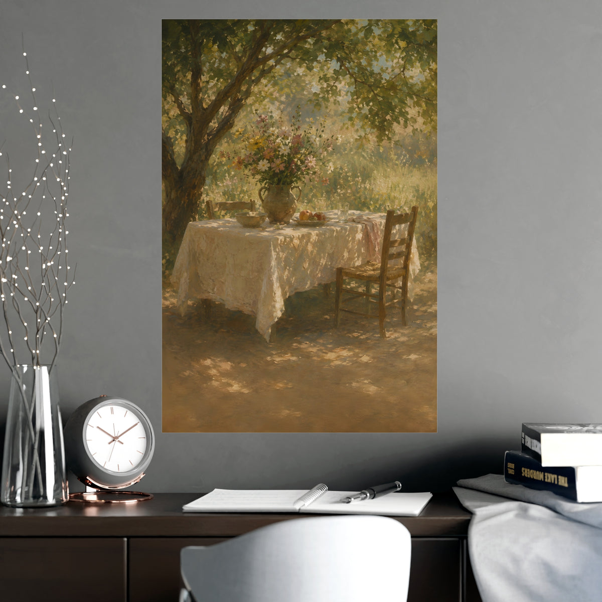 Table Under the Tree — a table under a tree with a linen cloth and a jug of wildflowers, shown framed on a wall