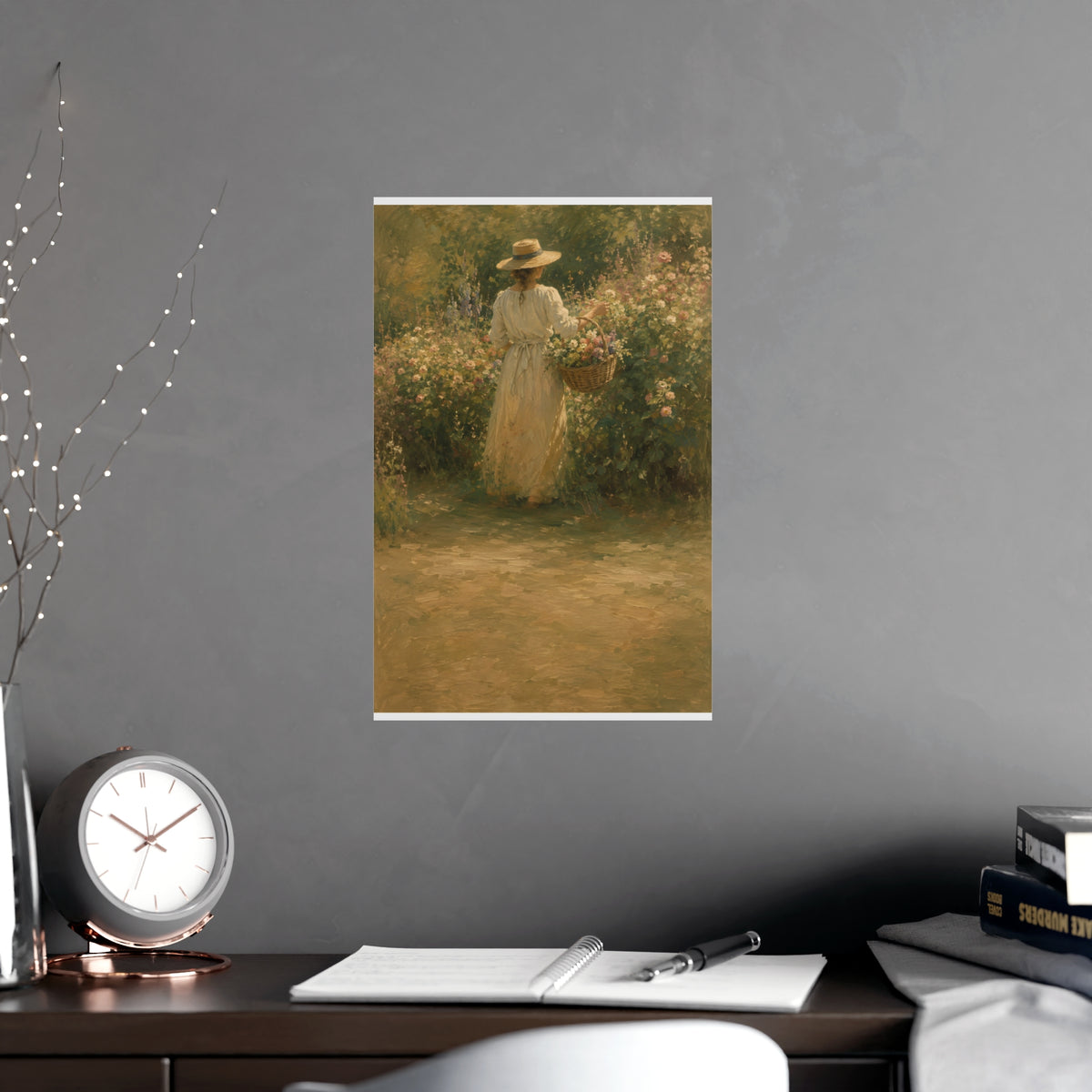 Gathering Flowers — a woman in a straw hat gathering flowers into a wicker basket, shown framed on a wall