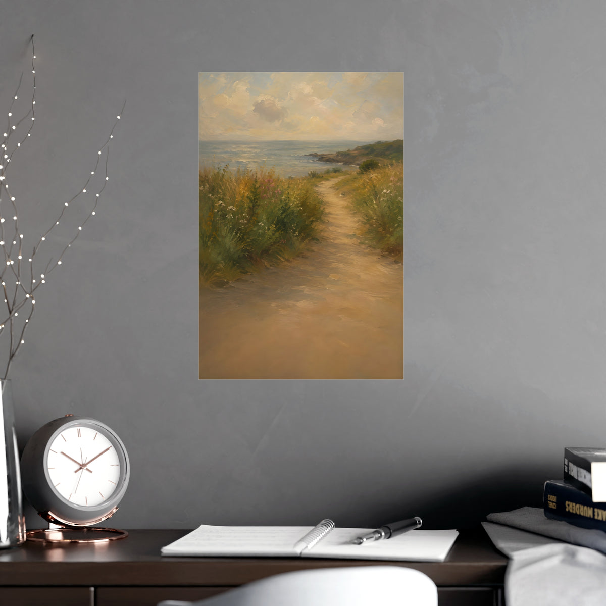 Coast Path — a sandy path through wild grasses and sea pinks with a calm sea beyond, shown framed on a wall