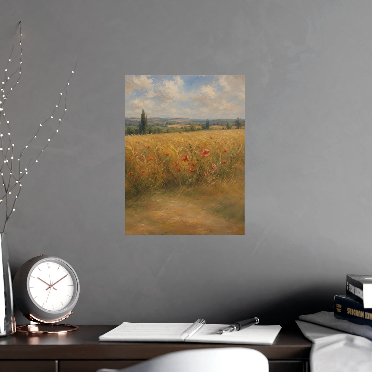 Poppies in the Wheat — wheat fields under a wide summer sky with poppies scattered through the gold, shown framed on a wall