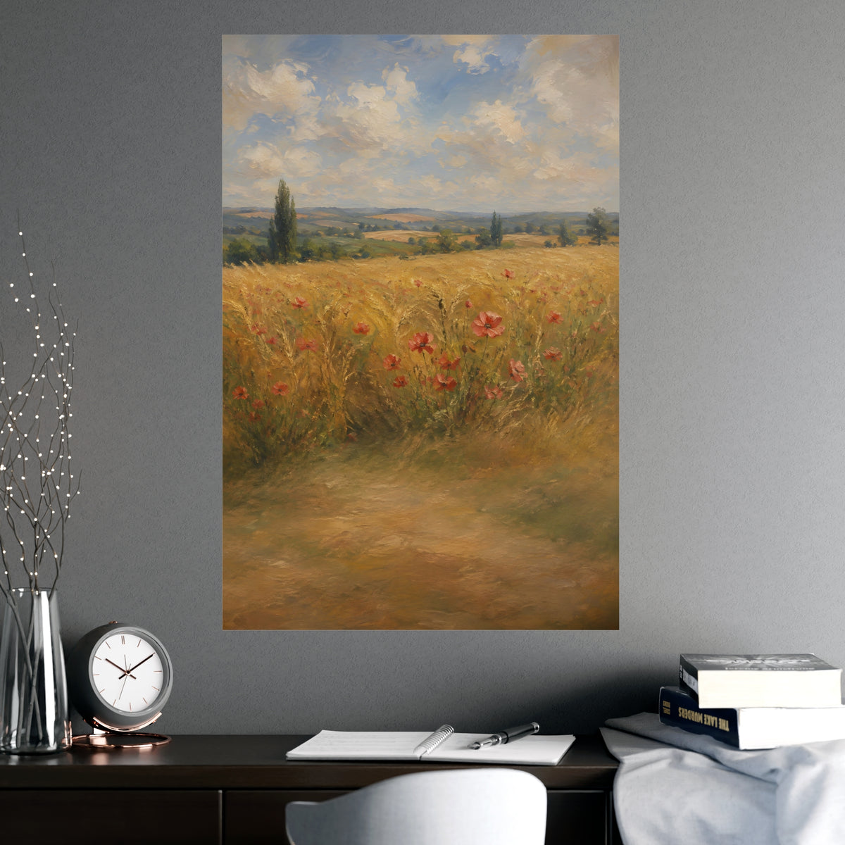 Poppies in the Wheat — wheat fields under a wide summer sky with poppies scattered through the gold, shown framed on a wall