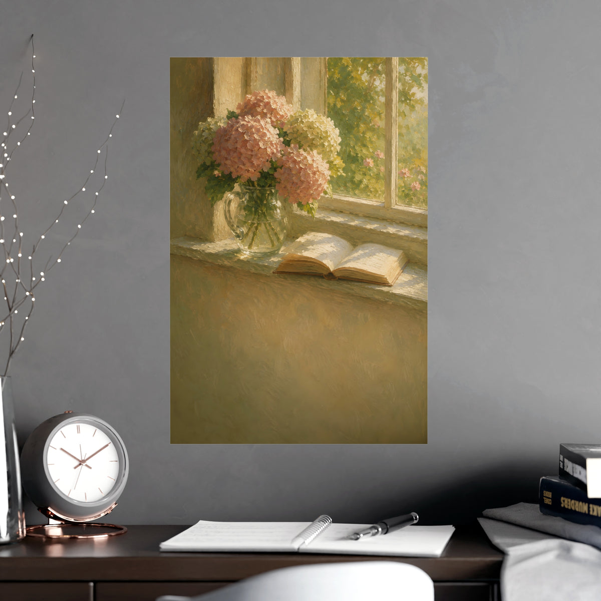 Hydrangeas and a Book — hydrangeas in a glass jug beside an open book on a sunlit windowsill, shown framed on a wall