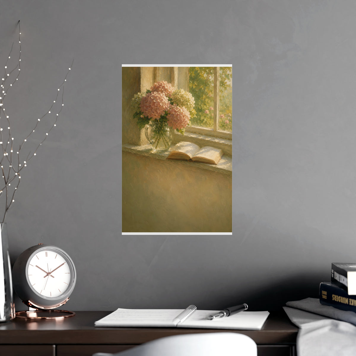 Hydrangeas and a Book — hydrangeas in a glass jug beside an open book on a sunlit windowsill, shown framed on a wall