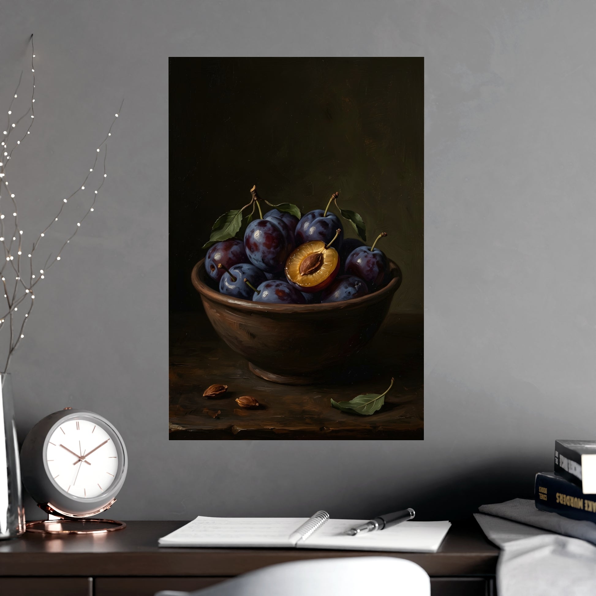 Bowl of Plums hung on a grey wall above a dark sofa, 16x24 in print