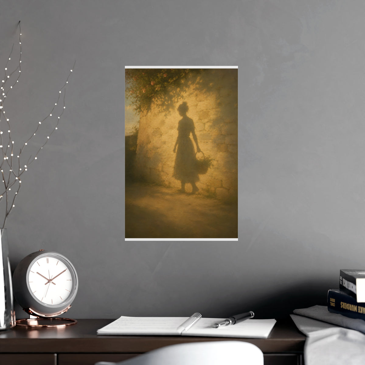 Her Shadow on the Wall — the long shadow of a woman carrying a basket, cast across a sunlit stone wall, shown framed on a wal