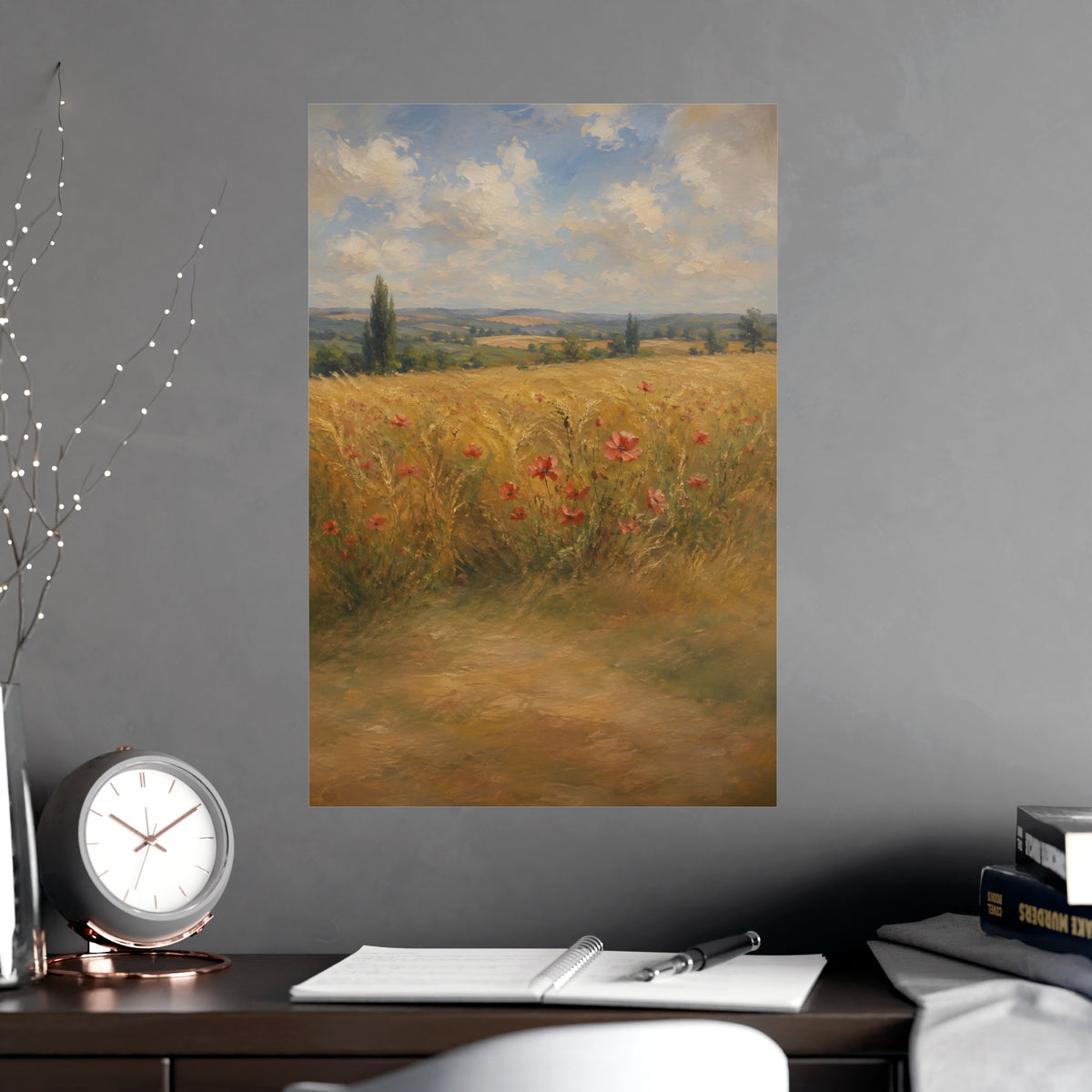 Poppies in the Wheat — wheat fields under a wide summer sky with poppies scattered through the gold, shown framed on a wall