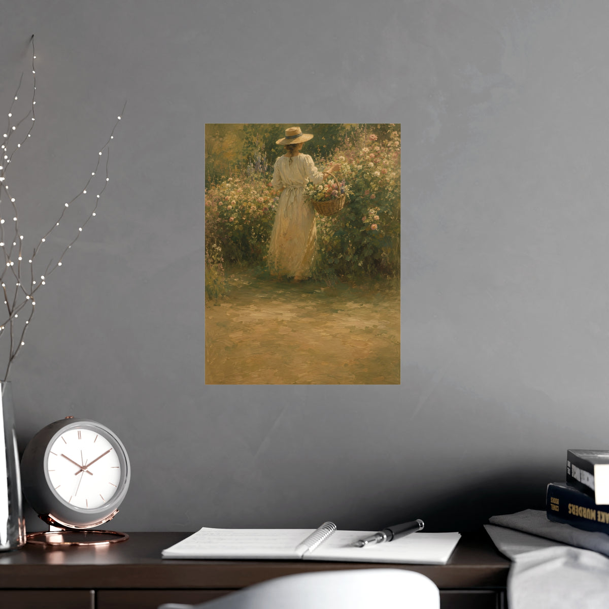 Gathering Flowers — a woman in a straw hat gathering flowers into a wicker basket, shown framed on a wall