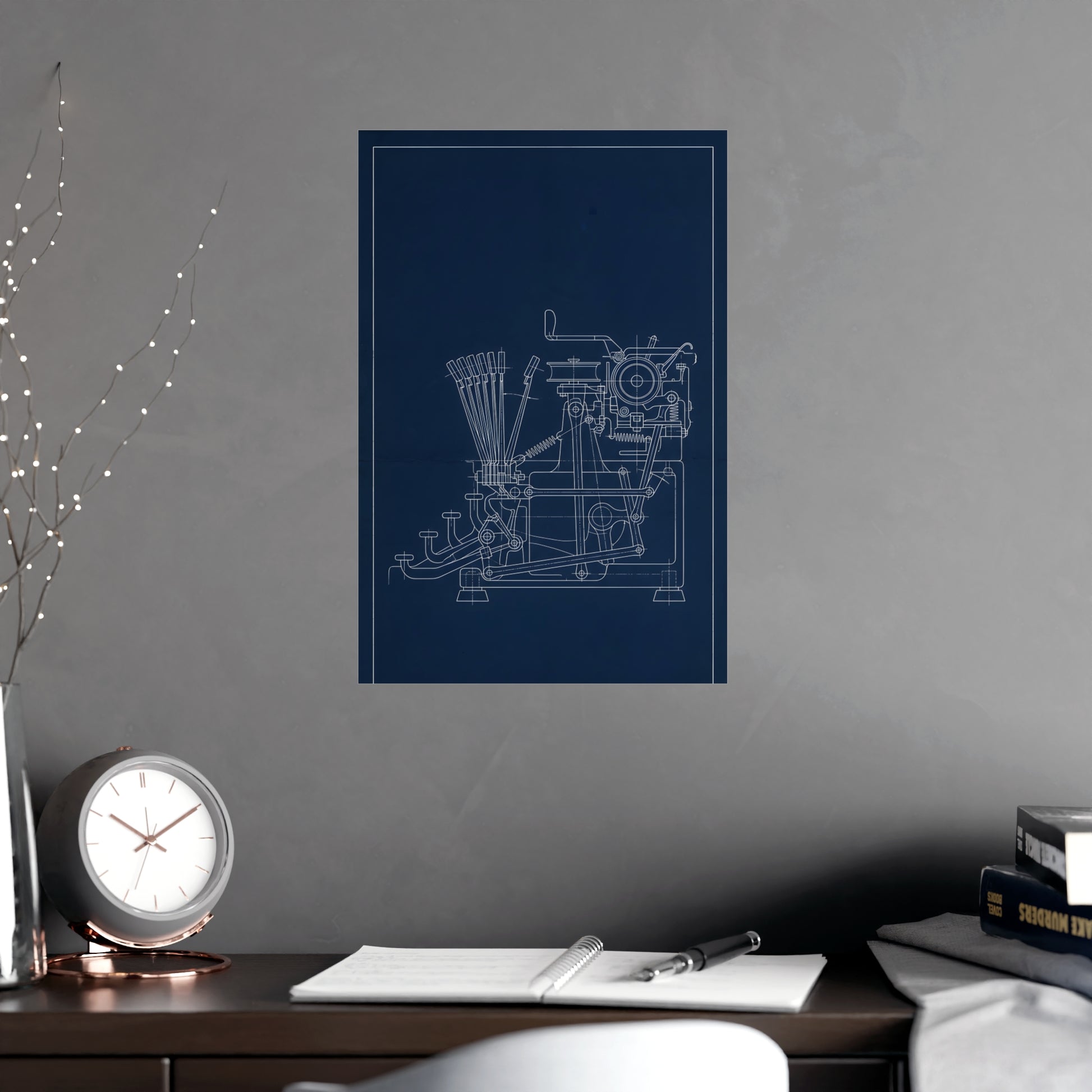 Typewriter Linkage hung above a desk with a clock and notebook, 12x18 in print