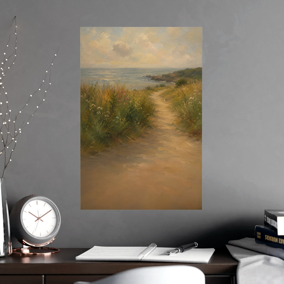 Coast Path — a sandy path through wild grasses and sea pinks with a calm sea beyond, shown framed on a wall