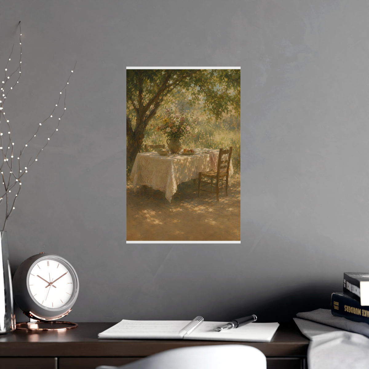 Table Under the Tree — a table under a tree with a linen cloth and a jug of wildflowers, shown framed on a wall