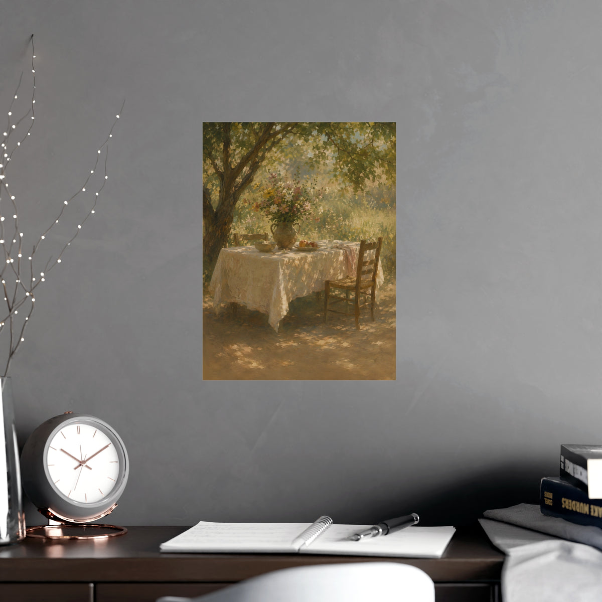 Table Under the Tree — a table under a tree with a linen cloth and a jug of wildflowers, shown framed on a wall