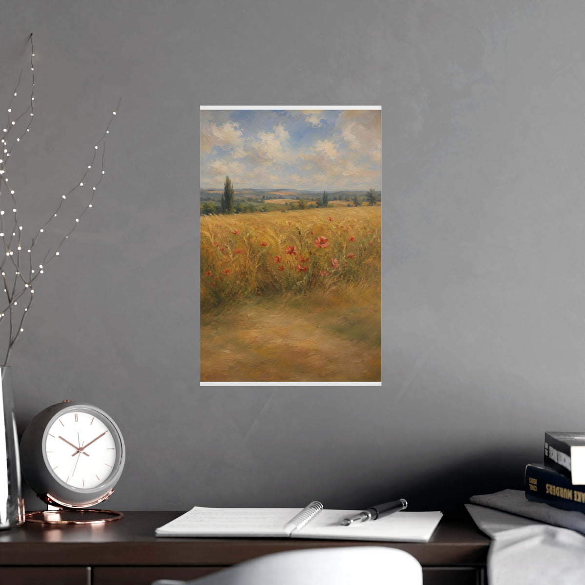 Poppies in the Wheat — wheat fields under a wide summer sky with poppies scattered through the gold, shown framed on a wall