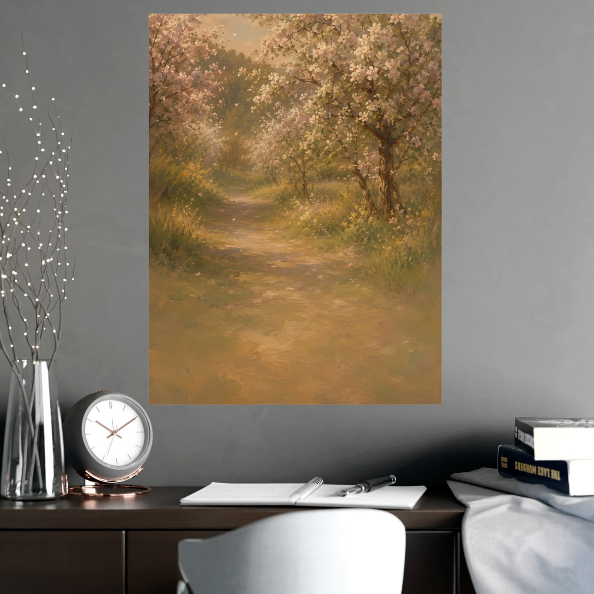 Orchard Path in Spring — a quiet orchard path with blossom drifting, shown framed on a wall