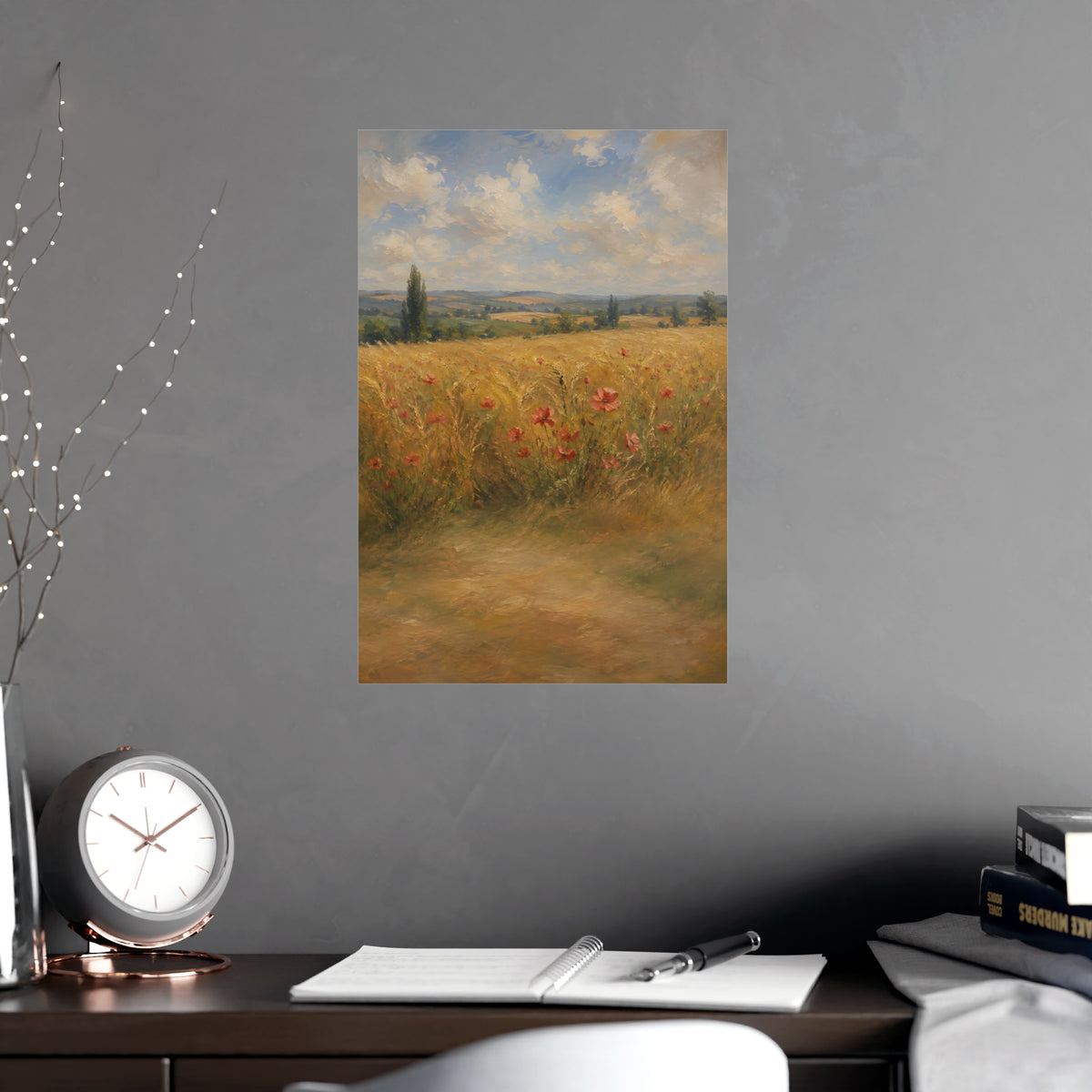 Poppies in the Wheat — wheat fields under a wide summer sky with poppies scattered through the gold, shown framed on a wall