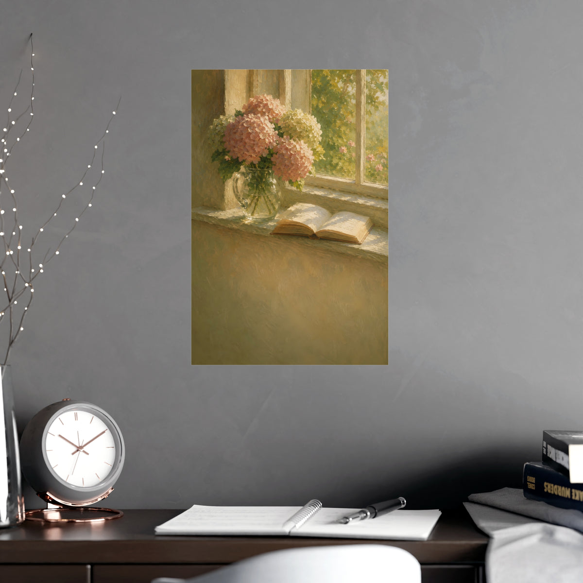 Hydrangeas and a Book — hydrangeas in a glass jug beside an open book on a sunlit windowsill, shown framed on a wall