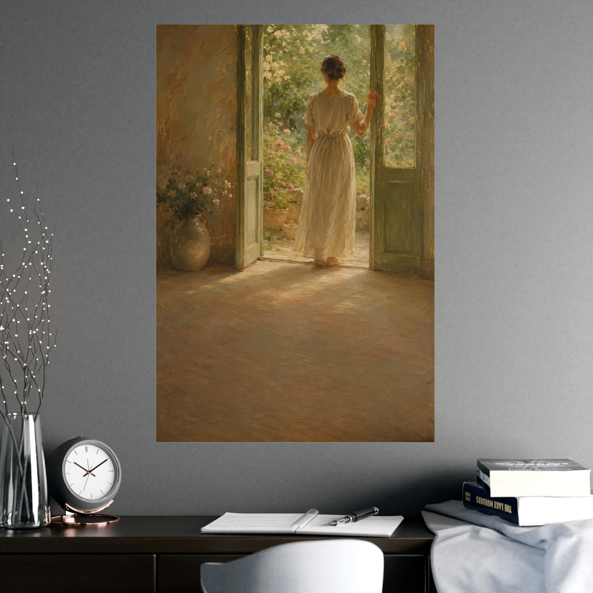 Doorway to the Garden — a woman in a linen dress standing in an open doorway looking out to a summer garden, shown framed on