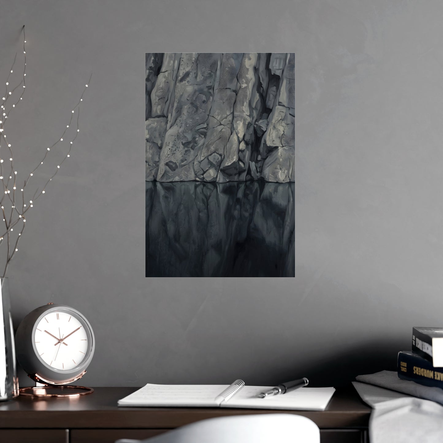 Still Water hung above a desk with a clock and notebook, 12x18 in print