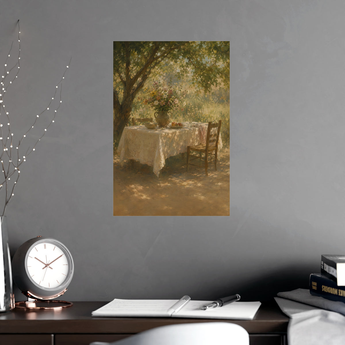 Table Under the Tree — a table under a tree with a linen cloth and a jug of wildflowers, shown framed on a wall