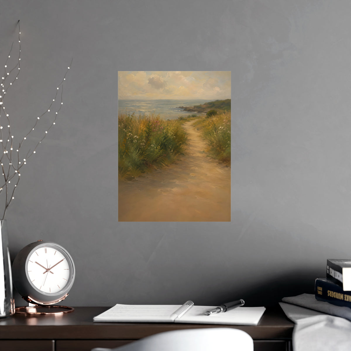 Coast Path — a sandy path through wild grasses and sea pinks with a calm sea beyond, shown framed on a wall